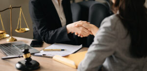 judge client shaking hands lawyers discussing contract papers after adviced background courtroom lawyer service concept office scaled 2